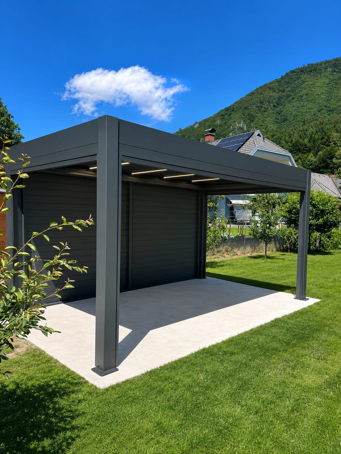 Free-standing anthracite PRESTIGE pergola with louvred side panels in a garden